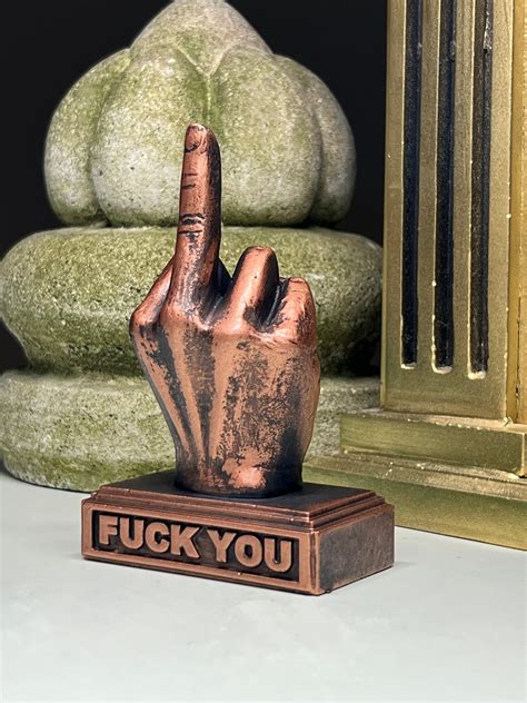 Well constructed and nicely packaged -- love the card. . Middle finger figurine